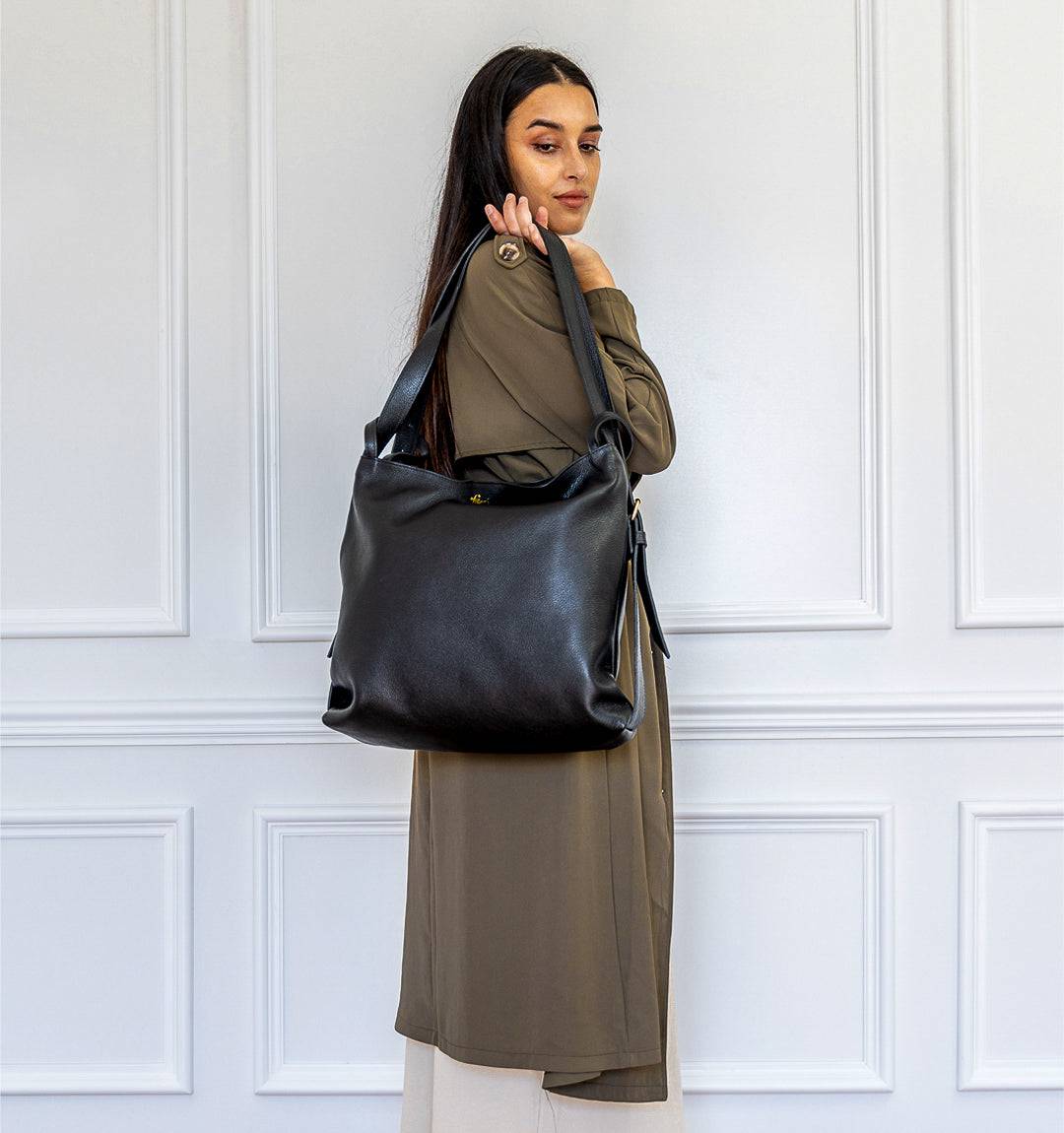AMARA Convertible leather Tote Bag in Black, multifunctional 2-in-1 bag that transforms from tote to backpack effortlessly.