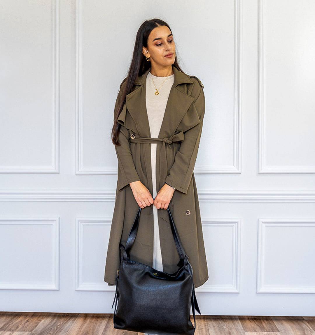 AMARA Leather Tote Bag in black, designed for versatility, carry it as a tote or switch to a backpack for hands-free convenience.