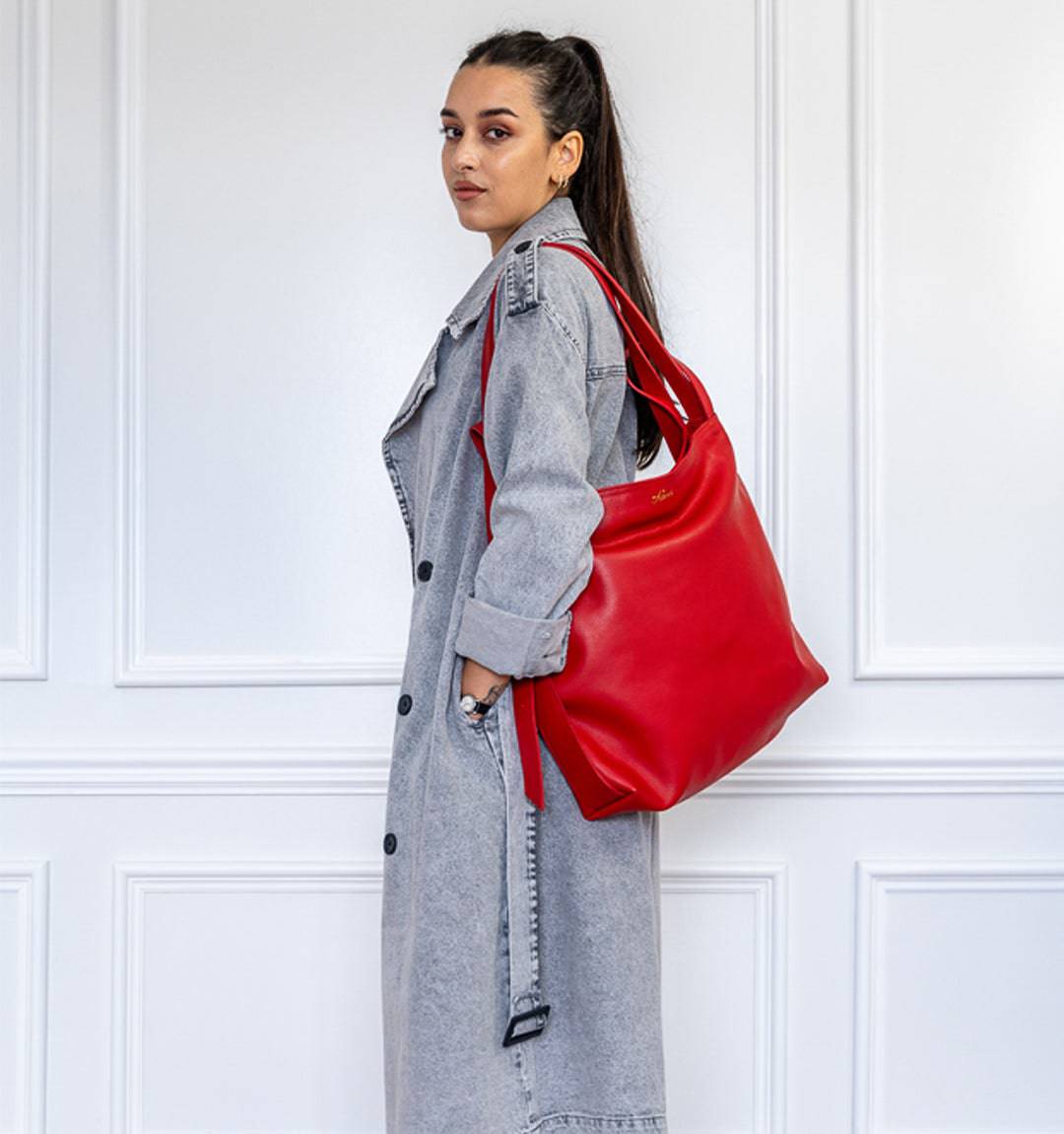 AMARA Convertible Leather Tote bag in Red, designed with a sleek silhouette and a durable leather.