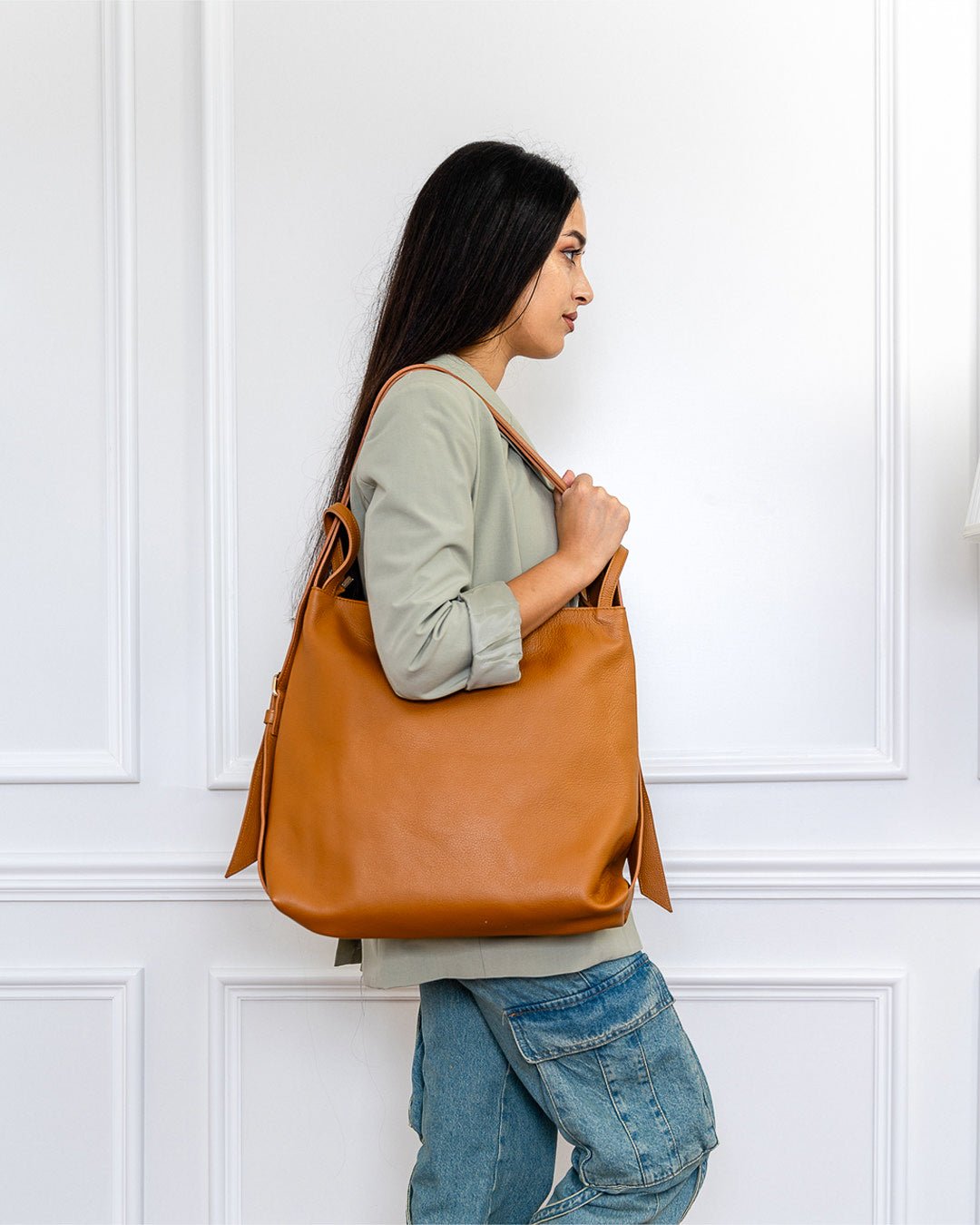 AMARA Convertible Leather Tote Tan, adjustable straps, and a versatile, hands-free carry option.