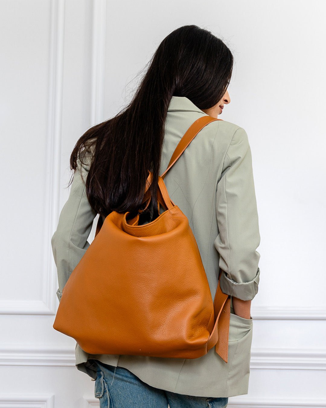 AMARA Convertible Leather Tote Tan, featuring a lightweight feel, adjustable straps, and the flexibility to switch between tote and backpack.