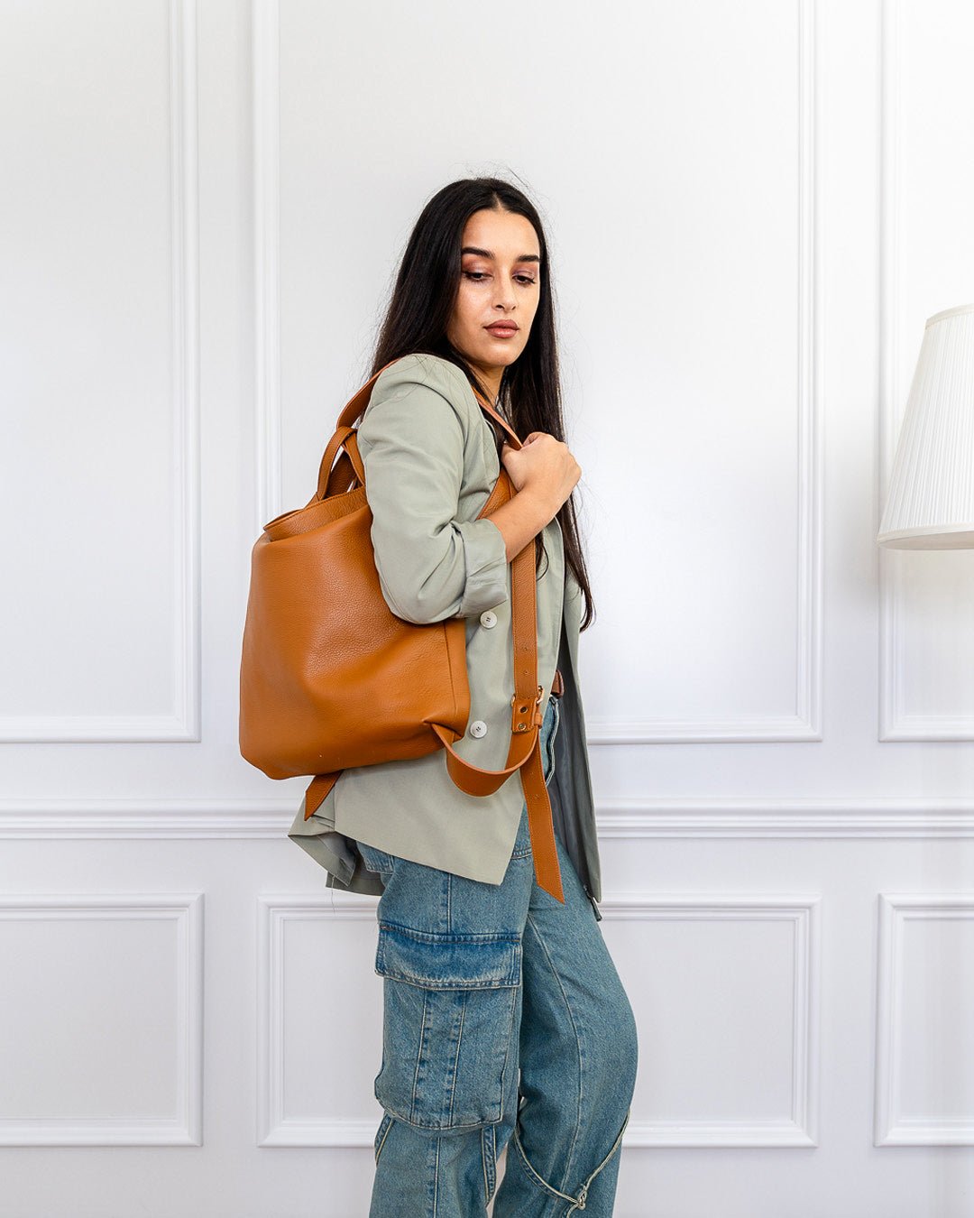 AMARA Convertible Leather Tote Tan, designed for dynamic lifestyles with a lightweight feel, adjustable straps, and a hands-free option.