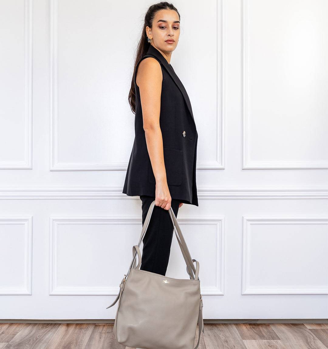 AMARA Leather Tote Bag in Grey, designed to switch seamlessly between a tote and a backpack for on-the-go convenience.