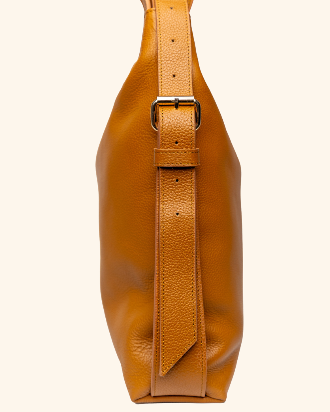 Side view of Fuleri convertible leather bag featuring adjustable straps for versatile styling.