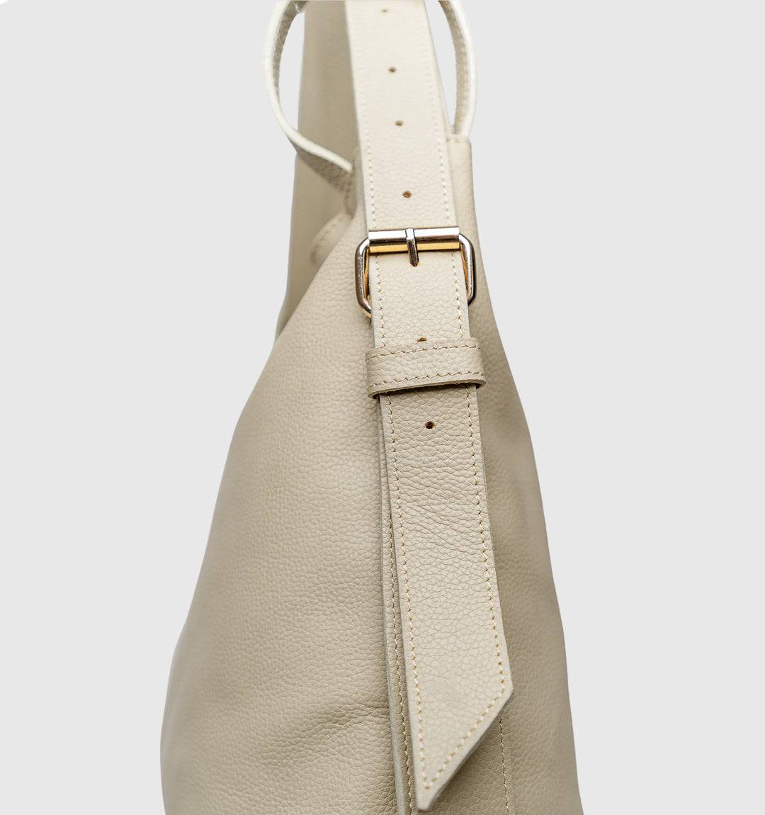 AMARA Convertible Leather Tote Beige, luxury on the go with lightweight durability, adjustable straps, and a secure top zipper.