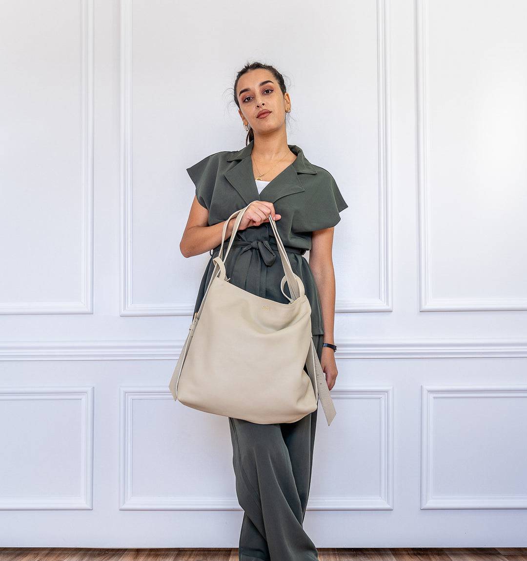 AMARA Convertible Leather Tote Beige, designed for effortless style with a convertible function, fine leather craftsmanship, and zippered security