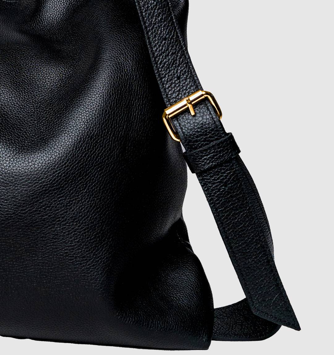 AMARA Convertible Leather Tote Bag Black, a modern statement piece with a structured silhouette, easy-access pockets, and convertible straps.